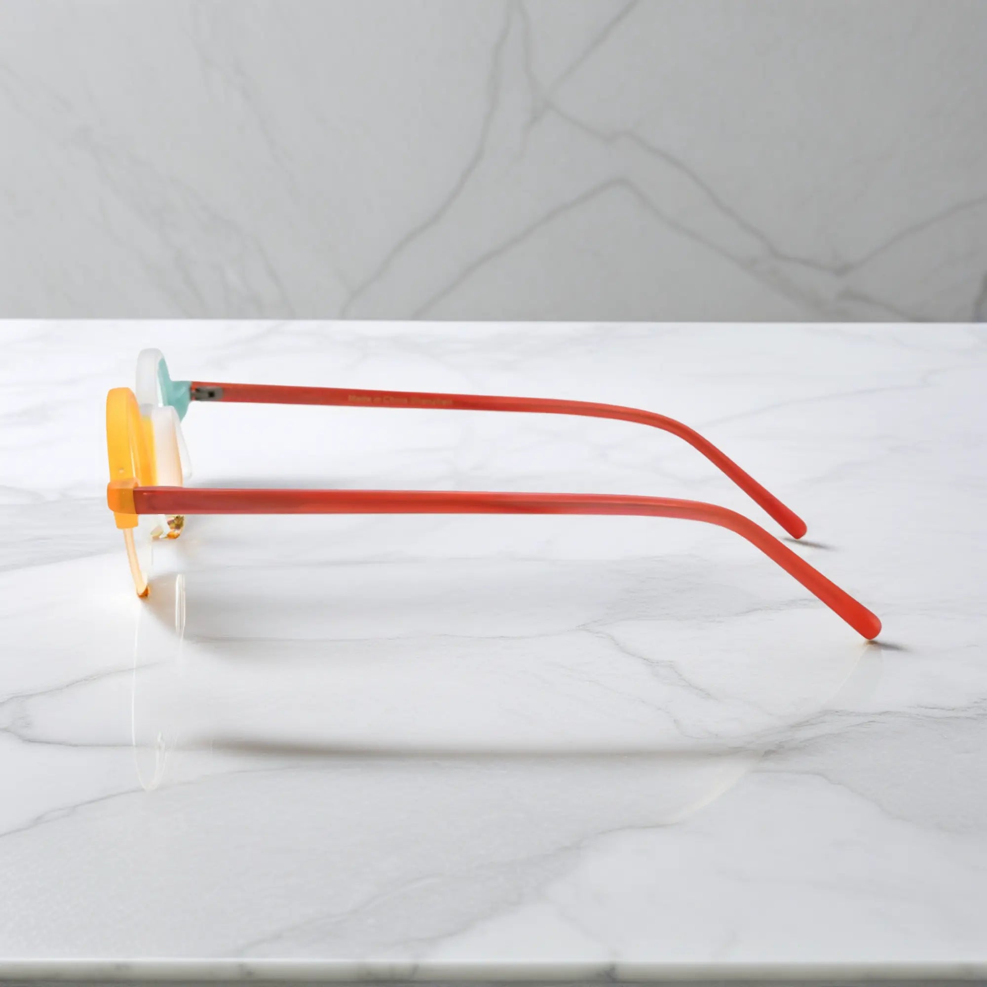 Side view showcasing VoyueLens™ Ivory-Orange matte acetate semi-rimless browline eyeglasses with lightweight design and red temples
